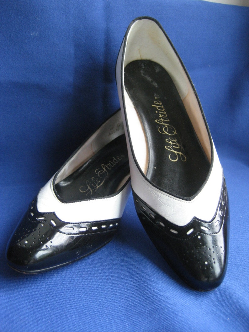 black and white spectator flats