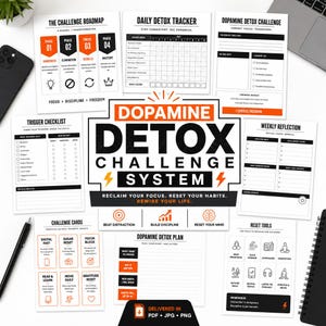 May include: A collection of white printable worksheets for a dopamine detox system. The worksheets include a daily detox tracker, challenge cards, and a weekly reflection sheet. The main title reads "Dopamine Detox Challenge System."