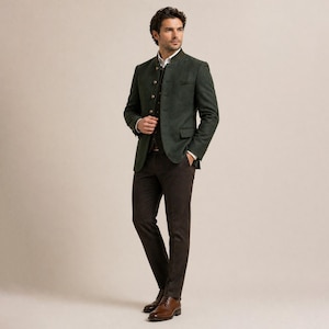 May include: A dark green blazer with a mandarin collar, paired with a dark vest and brown trousers. The blazer has a tailored fit and button details. The outfit is completed with brown leather shoes.