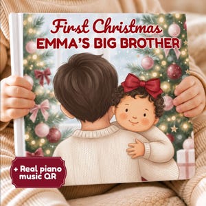 May include: A hardback children's book titled First Christmas EMMA'S BIG BROTHER featuring an illustration of a child hugging a baby with a red bow in their hair. The background shows a Christmas tree with ornaments. Includes a QR code label.