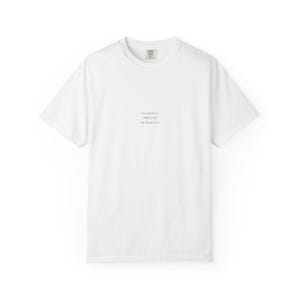 May include: A white crew neck t-shirt with short sleeves. The shirt has a small tag at the neckline and a printed design in the center. The text on the shirt reads: "OCEAN RETREATS, CERAMIC BRANDS, SHALOM WATERFALL."