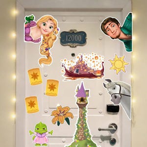 May include: A white door decorated with stickers featuring characters and scenes from the animated movie "Tangled." Includes Rapunzel, Flynn Rider, Maximus, Pascal, lanterns, and the tower. A door number plaque reads "12000".