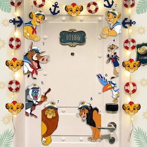 May include: A white door decorated with Lion King themed cutouts, including Simba, Timon, Pumbaa, and Zazu. Decorative anchors, life preservers, and string lights are also present. The door has a blue address plaque with the number 10186.