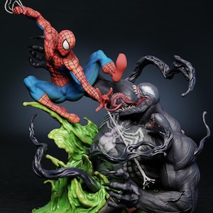 May include: A detailed figurine depicting Spider-Man in a dynamic pose, battling Venom. Spider-Man is in a red and blue suit, while Venom is a large, black figure with a white spider emblem. The base features green, liquid-like elements.