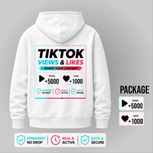 Könnte beinhalten: Weißer Kapuzenpullover mit einem Aufdruck auf der Rückseite mit der Aufschrift "TIKTOK VIEWS & LIKES" mit dem Text "BOOST YOUR CONTENT". Die Grafik enthält eine Wiedergabetaste mit +5000 und ein Herz mit +1000. Der Hoodie hat auch die Wörter "PERMANENT NO DROP", "REAL & ACTIVE" und "SAFE & SECURE".
