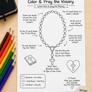 May include: A white educational worksheet titled Color & Pray the Rosary with a black line drawing of a rosary, a Bible, and a heart with a cross. The page includes instructional text for prayer, a colour-coded bead guide, and a circular stamp.