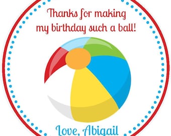 May include: Round white thank you sticker with a red border and blue polka dots. The sticker features a colorful beach ball and the text "Thanks for making my birthday such a ball! Love, Abigail."
