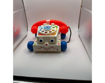 Vintage FisherPrice Chatter-telefoon 747 uit 1985, trekspeelgoed met rollende ogen