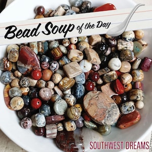 May include: A white bowl filled with a variety of multi-colored stone beads in assorted shapes and sizes. A graphic overlay features the text "Bead Soup of the Day" with a spoon illustration and the text "SOUTHWEST DREAMS" at the bottom.