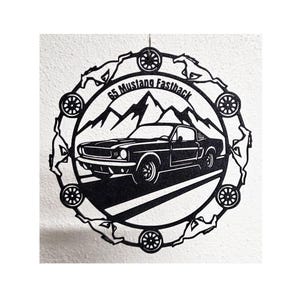 May include: A black circular metal wall art piece featuring a 1965 Mustang Fastback car silhouette in front of mountain peaks. The border is decorated with alternating horse and wheel motifs. The text 65 Mustang Fastback is engraved at the top.