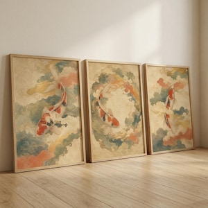 May include: A set of three rectangular wall art prints featuring koi fish swimming amidst stylized clouds. Each print displays a koi with orange, white, and black scales surrounded by soft, muted watercolor-style clouds in shades of blue, peach, and cream.
