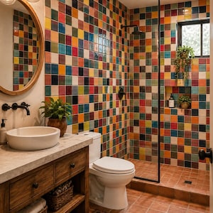 May include: A bathroom featuring walls covered in multi-colored square tiles in shades of red, orange, yellow, blue, and green. The space includes a wooden vanity with a white vessel sink, a round mirror, a white toilet, and a walk-in shower.