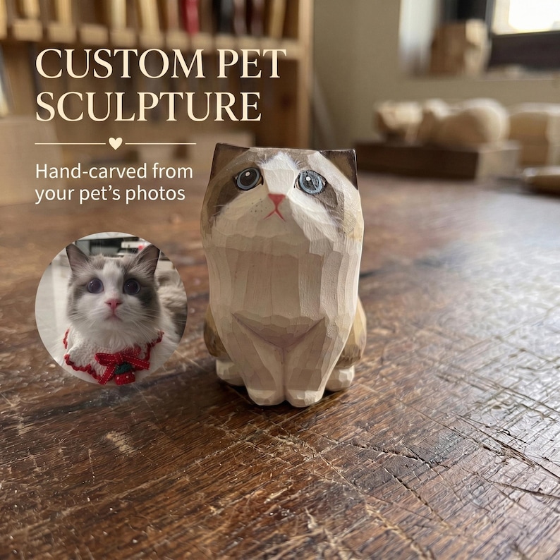 May include: A hand-carved wooden cat sculpture featuring brown and white markings, blue eyes, and a pink nose. The text CUSTOM PET SCULPTURE and Hand-carved from your pet's photos is visible, along with a circular inset photo of a cat wearing a red collar.