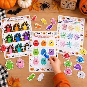 May include: Three educational Halloween activity sheets titled Ghosts go home, Feed the monsters, and Spider colour match, featuring colourful illustrations of houses, monsters, and spiderwebs, accompanied by matching candy and spider cutouts.