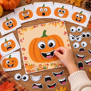 May include: A square game board featuring a large orange pumpkin illustration surrounded by autumn leaves, accompanied by various interchangeable facial features including eyes and mouths, along with several cards showing different pumpkin expressions.
