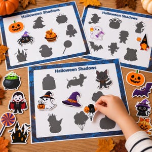 May include: Three white activity sheets titled Halloween Shadows featuring various colorful Halloween-themed stickers and their corresponding dark gray silhouettes, including a pumpkin, spider, ghost, vampire, witch hat, and a haunted house.