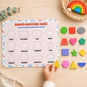 May include: A shapes matching game board with the text SHAPES MATCHING GAME and LEARN & MATCH GEOMETRIC SHAPES. The board features outlines of twelve shapes including a circle, rectangle, oval, heart, square, pentagon, trapezoid, star, triangle, hexagon, semicircle, and diamond. Colourful wooden shape pieces are included.