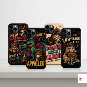 May include: Four smartphone cases featuring colorful graphic illustrations of cats and dinosaurs. The designs include text such as NEW ACHIEVEMENT, MONGO IS APPALLED, DONUTS ARE MY CARDIO, and THE DESPERADO CLUB, set against dark and light backgrounds.