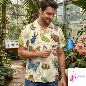 May include: A short-sleeved button-down shirt in a light cream color featuring an all-over print of various colorful insects including beetles, butterflies, bees, and caterpillars, with a classic collar and a front button closure.