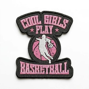 May include: Embroidered patch with the text "COOL GIRLS PLAY BASKETBALL" in pink lettering. The patch features a basketball and a silhouette of a person playing basketball. The patch has a black border.