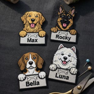 May include: Embroidered dog patches featuring a Golden Retriever, German Shepherd, Beagle, and Samoyed. Each patch has a name on a sign, including "Max", "Rocky", "Bella", and "Luna". The patches are on a dark gray fabric.