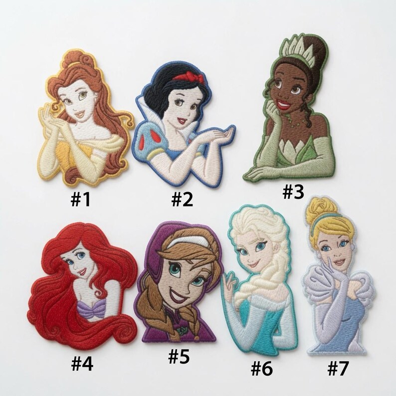 May include: Seven embroidered character patches labeled #1 through #7. The patches feature animated figures including a woman with brown hair, a woman with black hair and a red bow, a woman with a green crown, a red-haired woman, a woman with braids, a blonde woman, and a blonde woman in a blue dress.