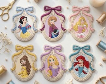 May include: Six oval embroidered patches featuring Disney princesses, each framed in a decorative border with a coloured bow at the top. The characters include Snow White, Anna, Aurora, Belle, Rapunzel, and Ariel, rendered in detailed thread work.