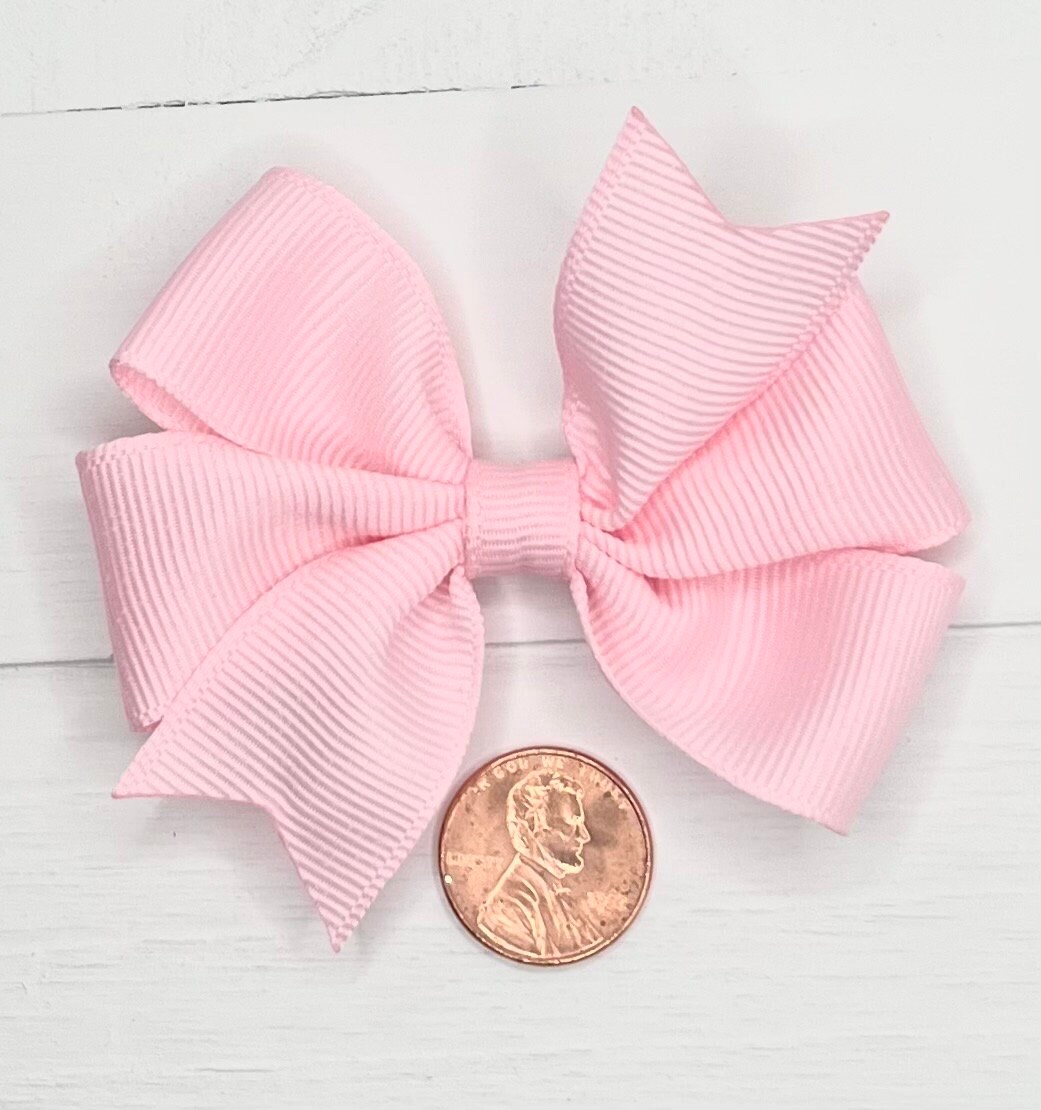 White Name on Light Pink Ribbon with Moonstitch – A Girl and Two Bows