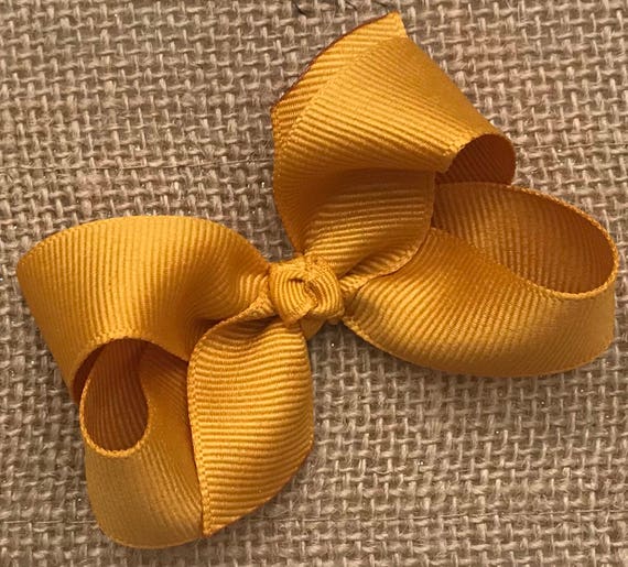 mustard baby bow