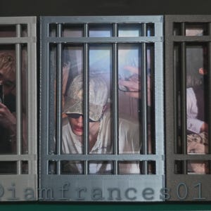 May include: Three rectangular frames with vertical bars resembling a prison cell, each containing a different photograph of a person. The frames are colored in shades of light gray, medium gray, and dark gray, with the text @iamfrances01 at the bottom.
