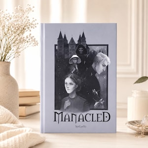 May include: A light blue hardcover book titled Manacled by SenLinYu. The cover features a black and white illustration of a castle, a hooded figure, and two individuals in the foreground. The title is printed in a bold, stylized black font.