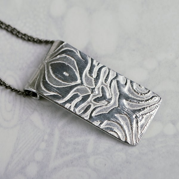 Swirl design embossed pendant silver aluminium on silver or rhodium plated chain