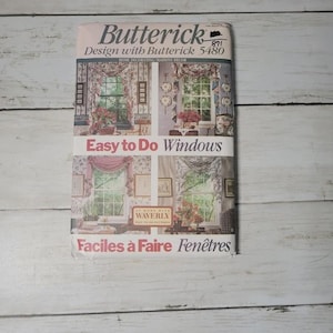 May include: A vintage Butterick sewing pattern for home decorating, featuring designs for windows. The pattern cover displays window treatments with floral curtains and valances. Text includes "Easy to Do Windows" and "Design with Butterick 5480".