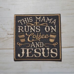 May include: Embroidered patch with the text "THIS MAMA RUNS ON Coffee AND JESUS" in gold thread on a black background. Features two coffee cup illustrations. The patch has a square shape with a gold border.