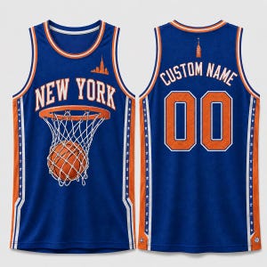 May include: A blue basketball jersey featuring the text NEW YORK and a graphic of a basketball in a hoop on the front. The back displays the text CUSTOM NAME and the number 00. The jersey has orange and white trim with star patterns on the sides.