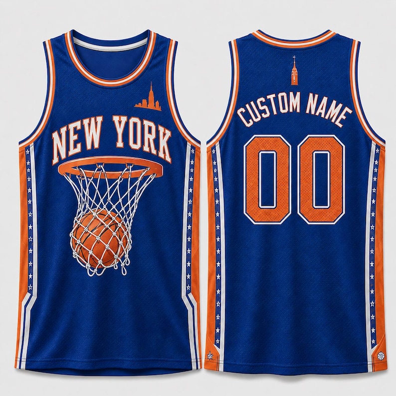 May include: A blue basketball jersey featuring the text NEW YORK and a graphic of a basketball in a hoop on the front. The back displays the text CUSTOM NAME and the number 00. The jersey has orange and white trim with star patterns on the sides.