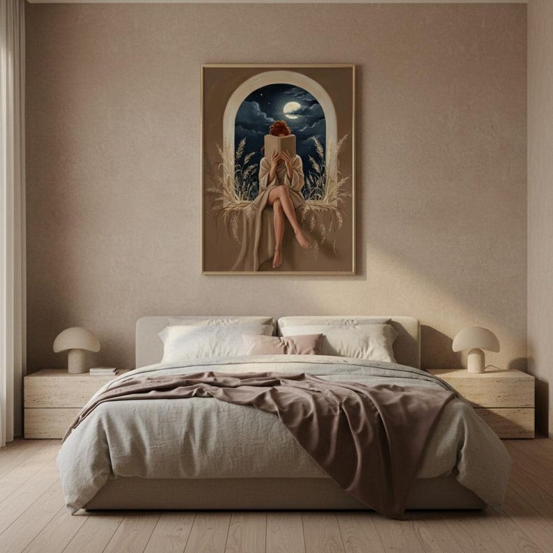 The moonlit reading print framed above a bed with linen bedding in a quiet neutral bedroom