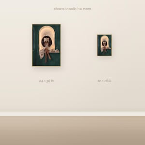 Scale comparison showing the Black woman with voluminous curls reading in an emerald green arched nook art print at 24x36 inches next to 12x18 inches on a wall.