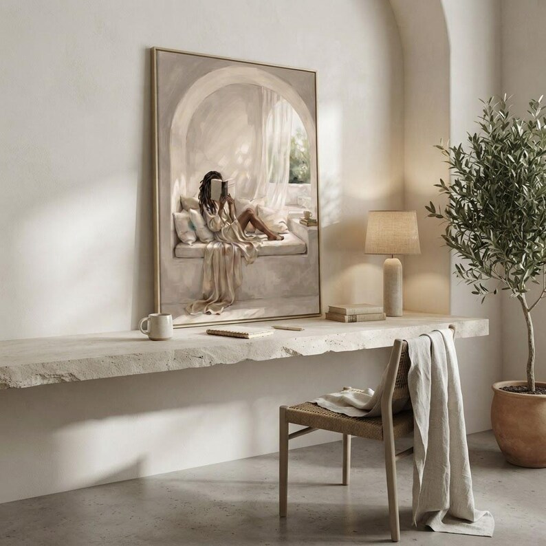 Neutral Black woman reading nook art in a restrained workspace with pale walls, natural linen textures, and a thin gold frame, no mat.