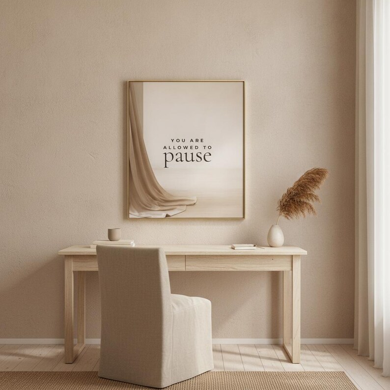 You Are Allowed to Pause styled in a restrained neutral office, hung in a thin gold frame with no mat. neutral printable wall art, minimalist home decor, Japandi style, calm living room decor, slow living digital download.