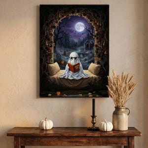The graveyard arch ghost reading print framed above an entryway console styled for autumn with white pumpkins and dried wheat