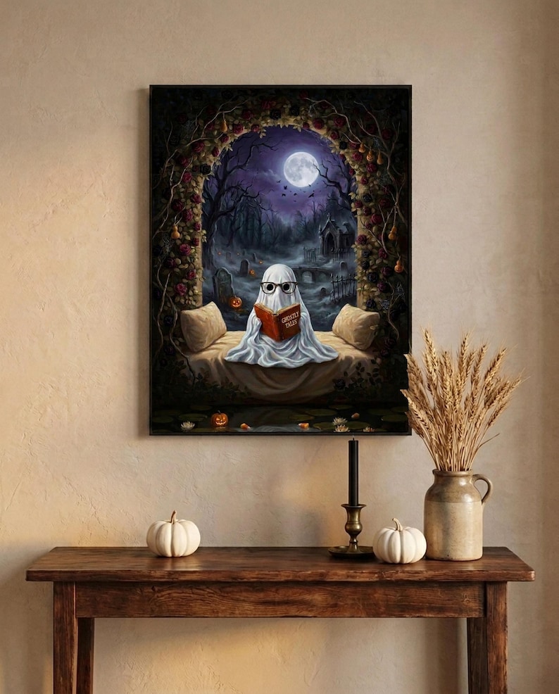 The graveyard arch ghost reading print framed above an entryway console styled for autumn with white pumpkins and dried wheat