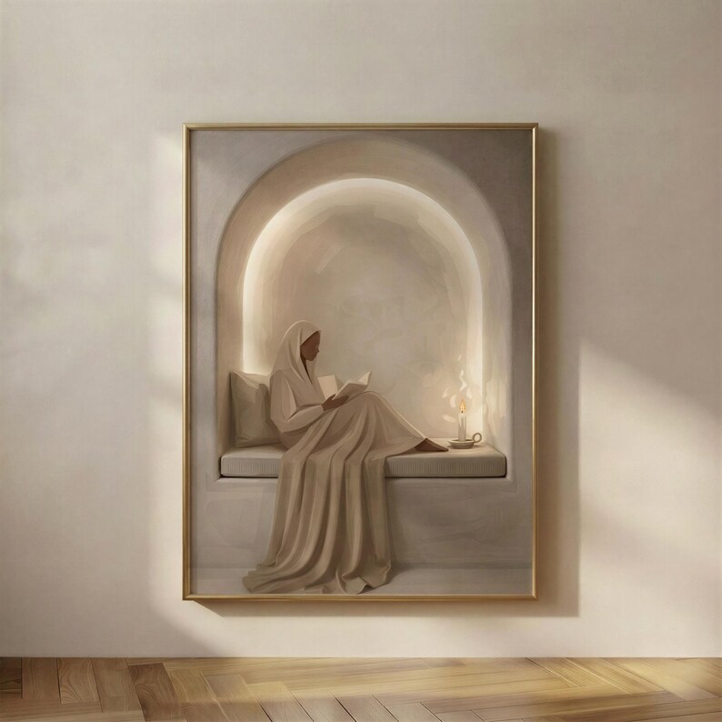 Soft Plaster Nook print in a gold frame: a robed woman reading on a bench inside a warmly lit arched alcove, a lit candle in a chamberstick beside her.