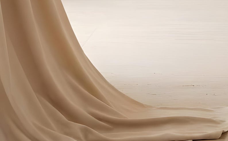 Detail from You Are Allowed to Pause, a cropped fragment of the printable artwork: a length of sheer linen falling and pooling across a pale wood floor, with no lettering in view.