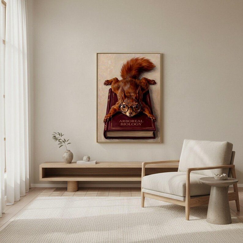 Red squirrel in glasses on a book art print framed above a low pale wood bench beside a linen armchair in a calm room with sheer curtains