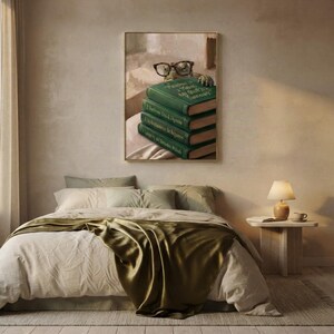 Turtle peeking over books art print framed on a textured plaster bedroom wall above linen bedding in soft morning light