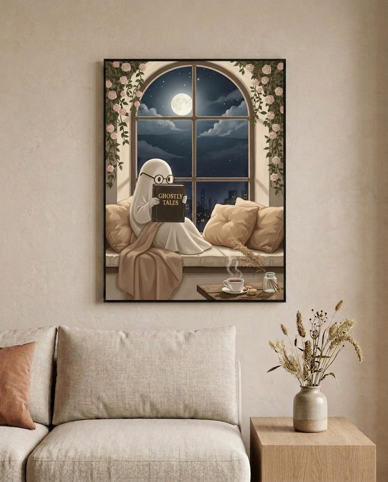 The window seat coffee ghost reading print framed in a calm neutral living room above a linen sofa