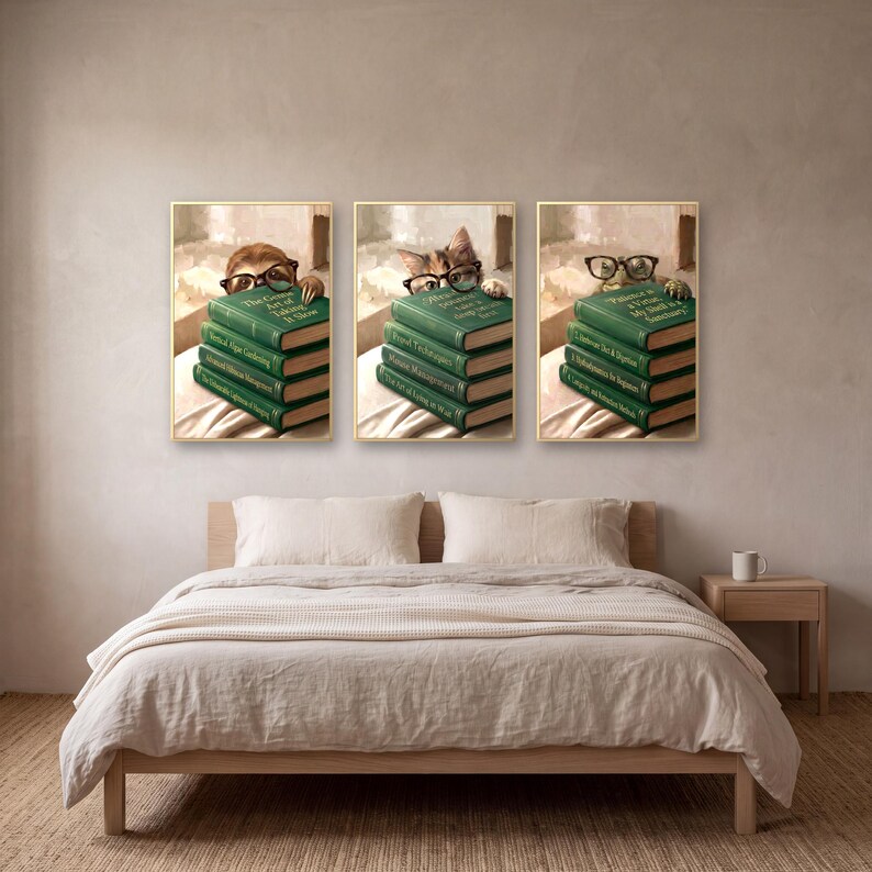 Three of the animals peeking over books prints framed above a bed made up in rumpled oatmeal linen, beside a pale oak nightstand with a cream mug.