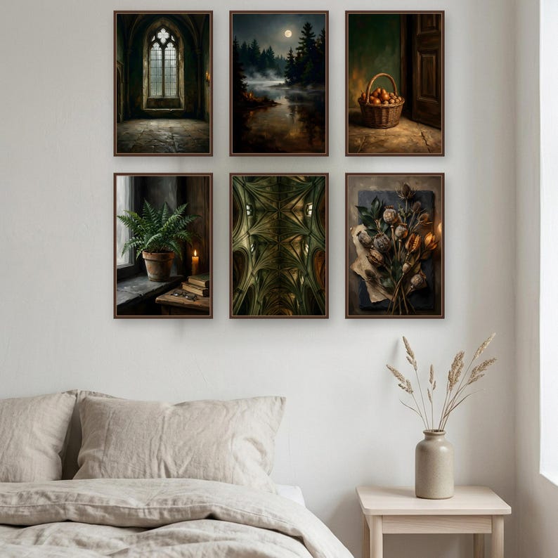 Six walnut framed prints hung as a three by two gallery wall above a linen bed on a pale wall: a gothic window hall, a moonlit lake, a woven basket of pears by a doorway, a potted fern on a sill, a vaulted ceiling, and dried poppy heads on paper