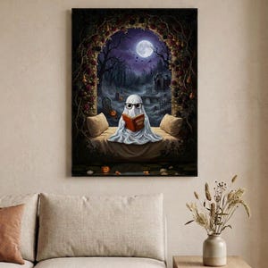 The graveyard arch ghost reading print framed in a calm neutral living room above a linen sofa